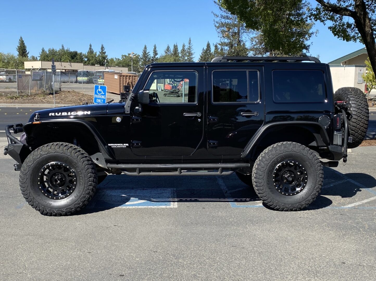 Black Jeep Wrangler Rubicon after exterior detail — driver side view
